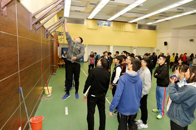 A student tries the vertical jump test.