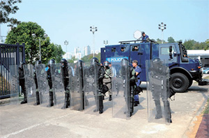 Police Tactical Unit officers undergo an anti-riot exercise.