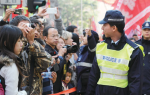 Auxiliary Police officers assist in crowd management.