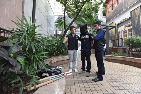 Photograph: Police officers of Organised Crime and Triads Bureau arresting a suspect