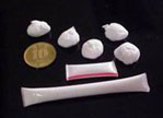 Heroin packed in a small pellet forms and plastic drinking straw