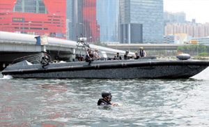 Special Duties Unit searches the waters near the cruise terminal at Kai Tak.