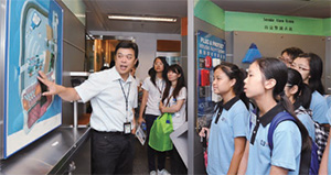 A Crime Prevention Bureau officer introduces security equipment to Fight Crime Ambassadors.