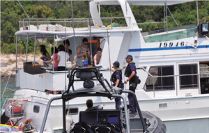 Members of the Sea Safety Guarding Angels distribute leaflets to members of the public.