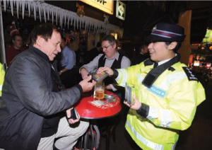 A Police officer promotes the ‘If you drink, don't drive' message to members of the public.