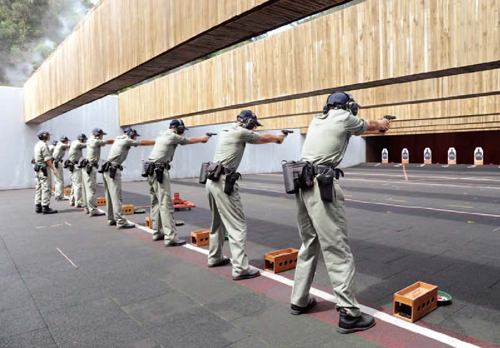 Recruit Police Constables undergo weapon training.