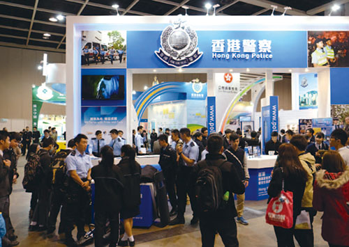 Education and Careers Expo visitors learn about policing duties at the Force booth.