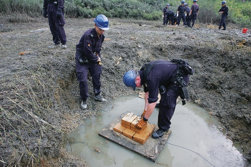 Explosive Ordnance Disposal Bureau is responsible
for all bomb work including rendering safe unexploded
ordnance from World War II.