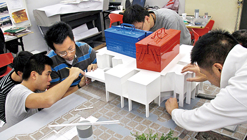 Members of the Briefing Support Unit producing a scale model to support an investigation.