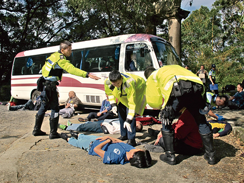 Traffic New Territories North officers participating in an exercise simulating a serious traffic accident. 