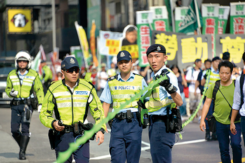 Hong Kong Island officers managing a public procession on Labour Day.