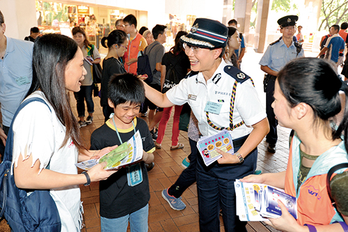 Officers interacting with the public at an Anti-Telephone Deception Bus Parade held on October 7.
