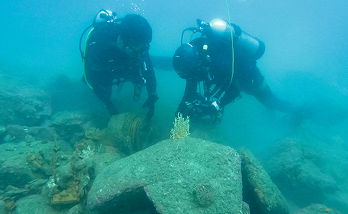 Special Duties Unit divers assisted the Explosive Ordnance Disposal Bureau in disposing of a naval mine in September.
