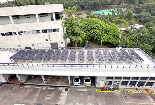 The Border District Headquarters harvest solar energy above its car park using photovoltaic panels .