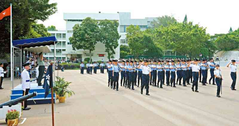 Graduates march past the reviewing stand