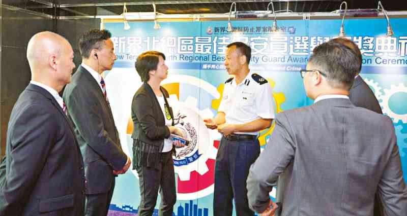 Mr Kwok Ho-fai (fourth from left) mingles with representatives of the security sector