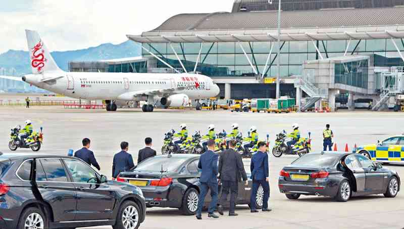 Officers escort President Xi Jinping's motorcade