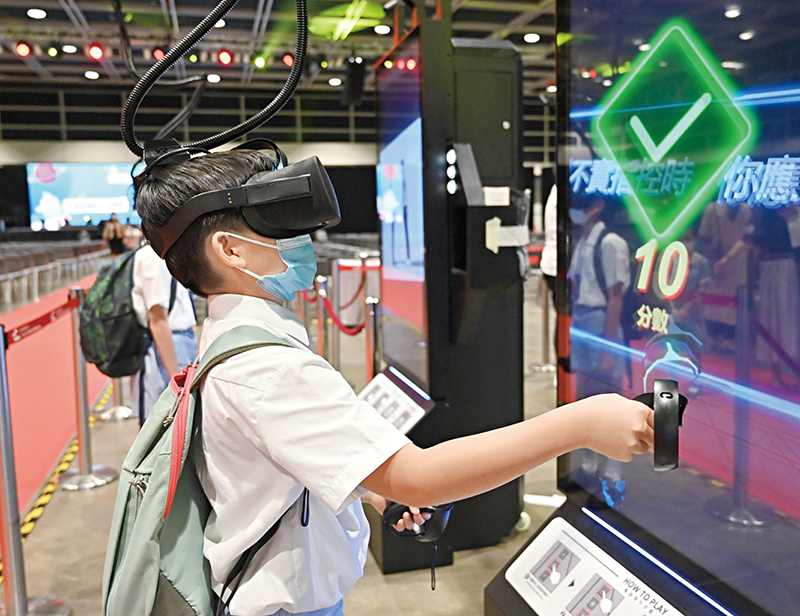 A participant experiences the fun of technology through a virtual reality game.