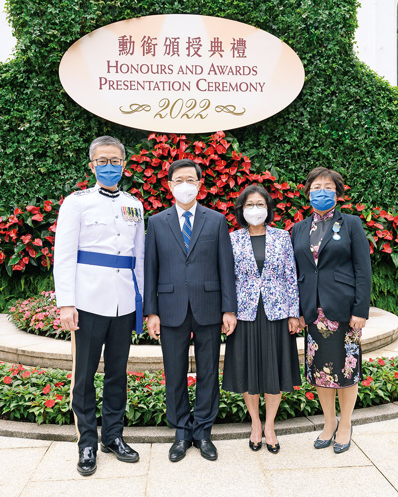 The Chief Executive Mr John Lee (second left) and Commissioner Siu Chak-yee (first left) congratulate the Force awardee of the Medal of Honour.