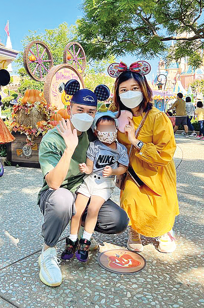 Ah Chi (left), Isabel (right) and a child under their foster care visit a theme park.